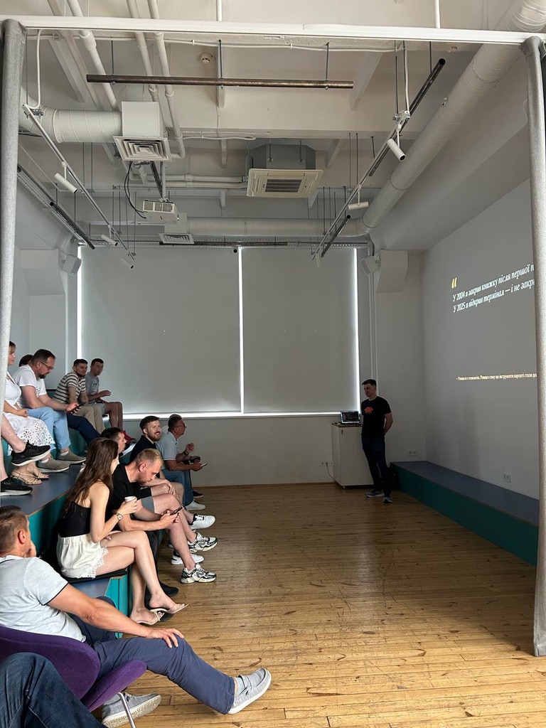 Vadym Lobariev presenting at Young Business Club Kyiv — Claude ecosystem talk, 2026